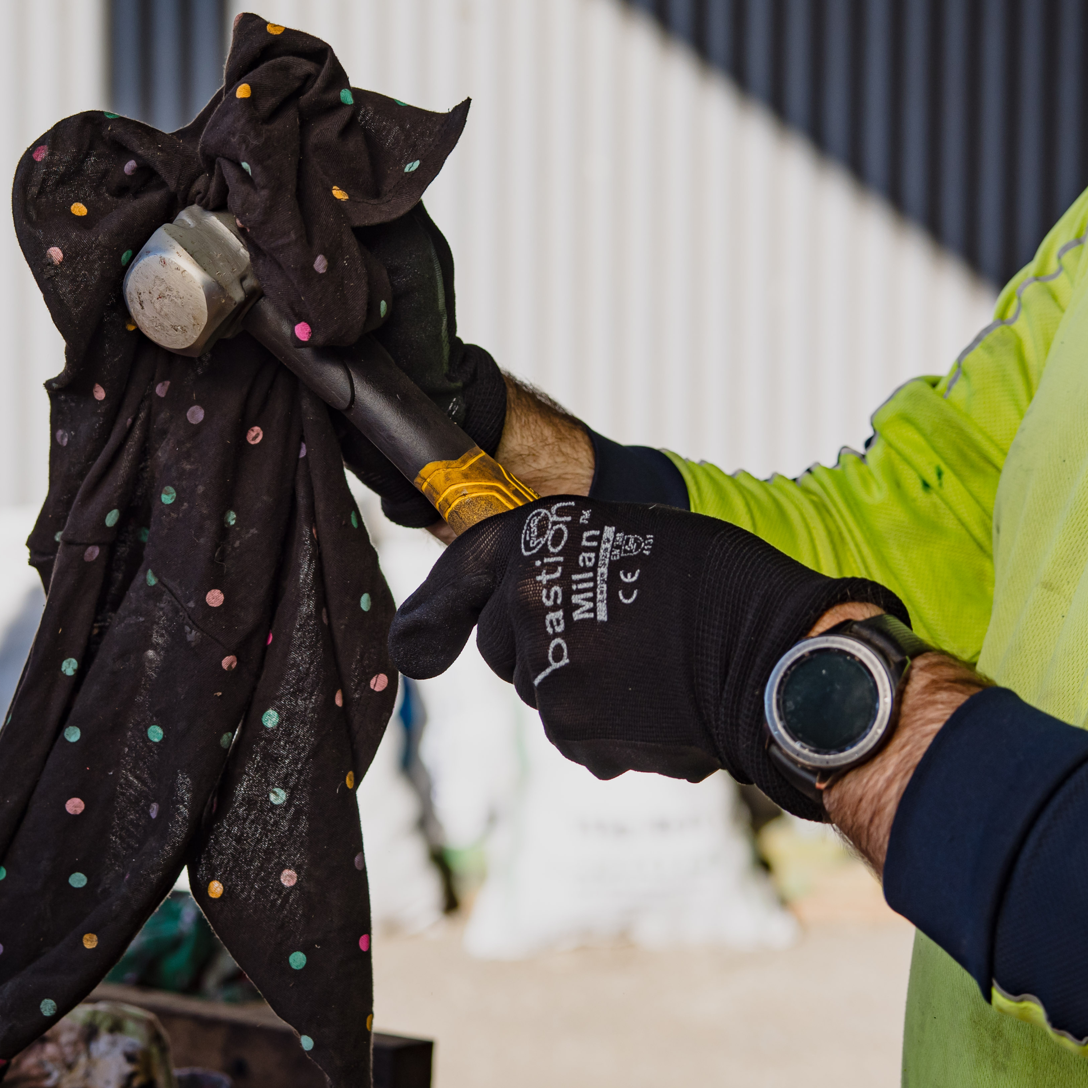 Black Bastion Milan industrial glove worn by handyman making repairs