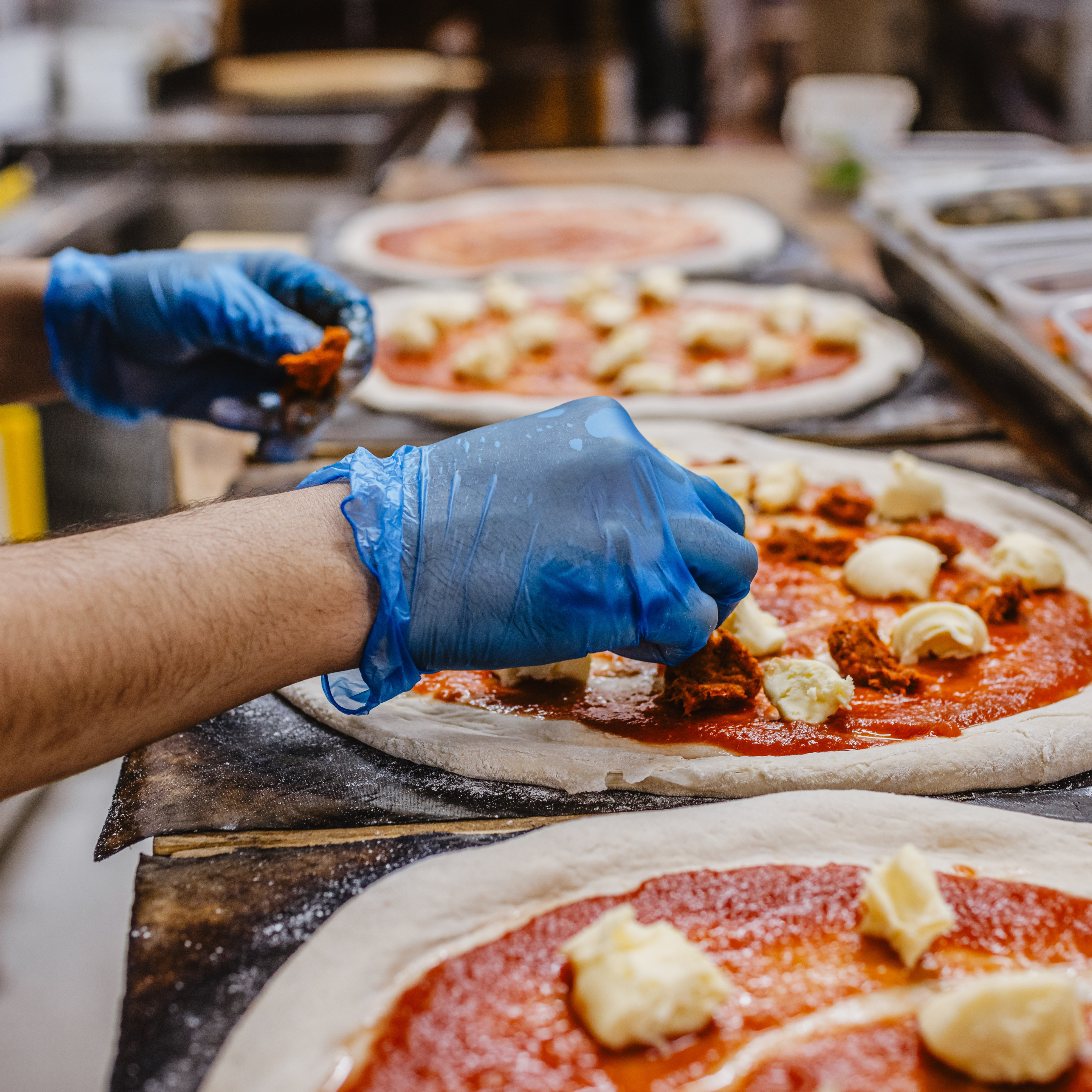 blue vinyl gloves in food prep