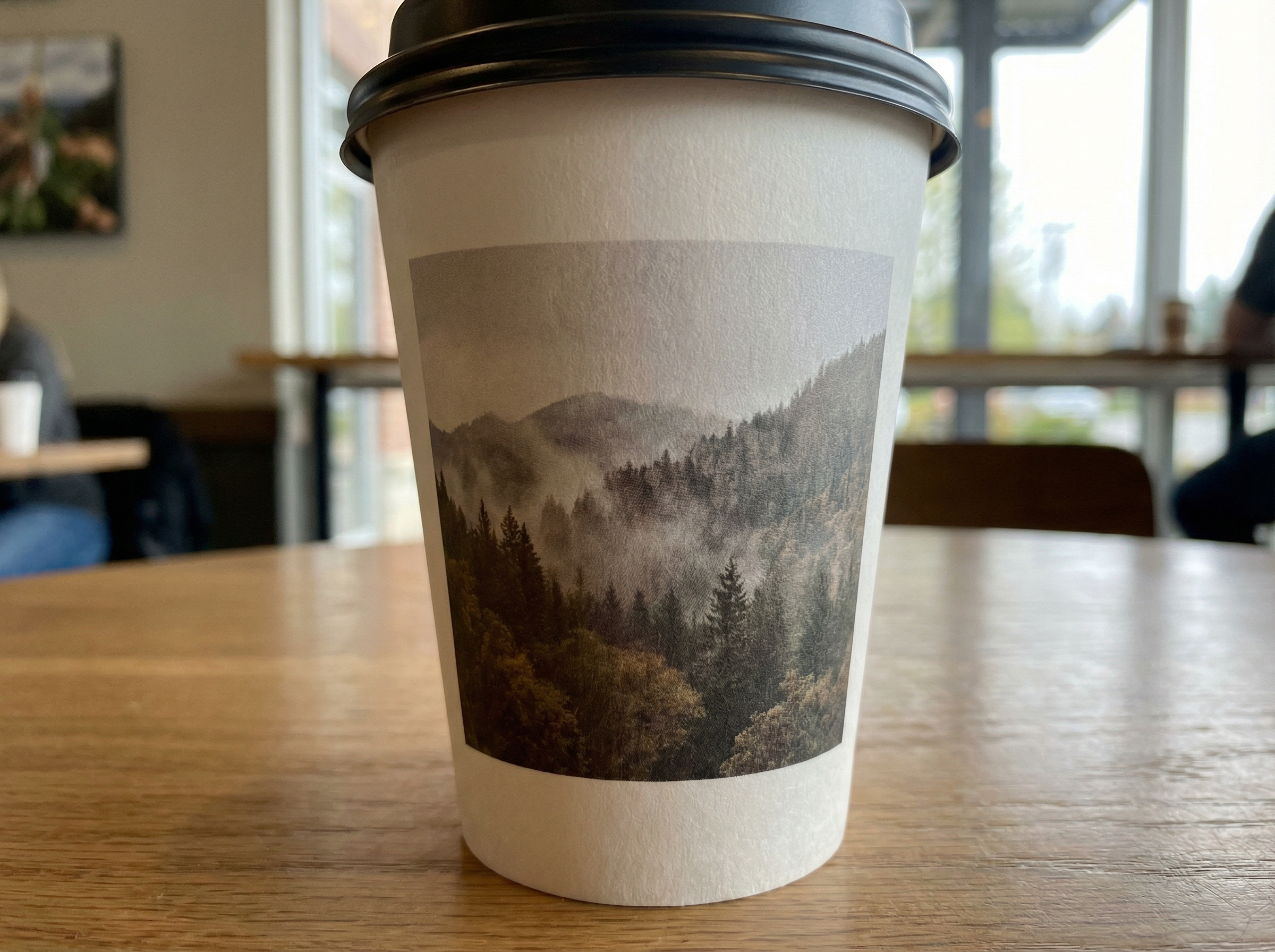 CMYK Printed white takeaway cup with photographic design on uncoated paper