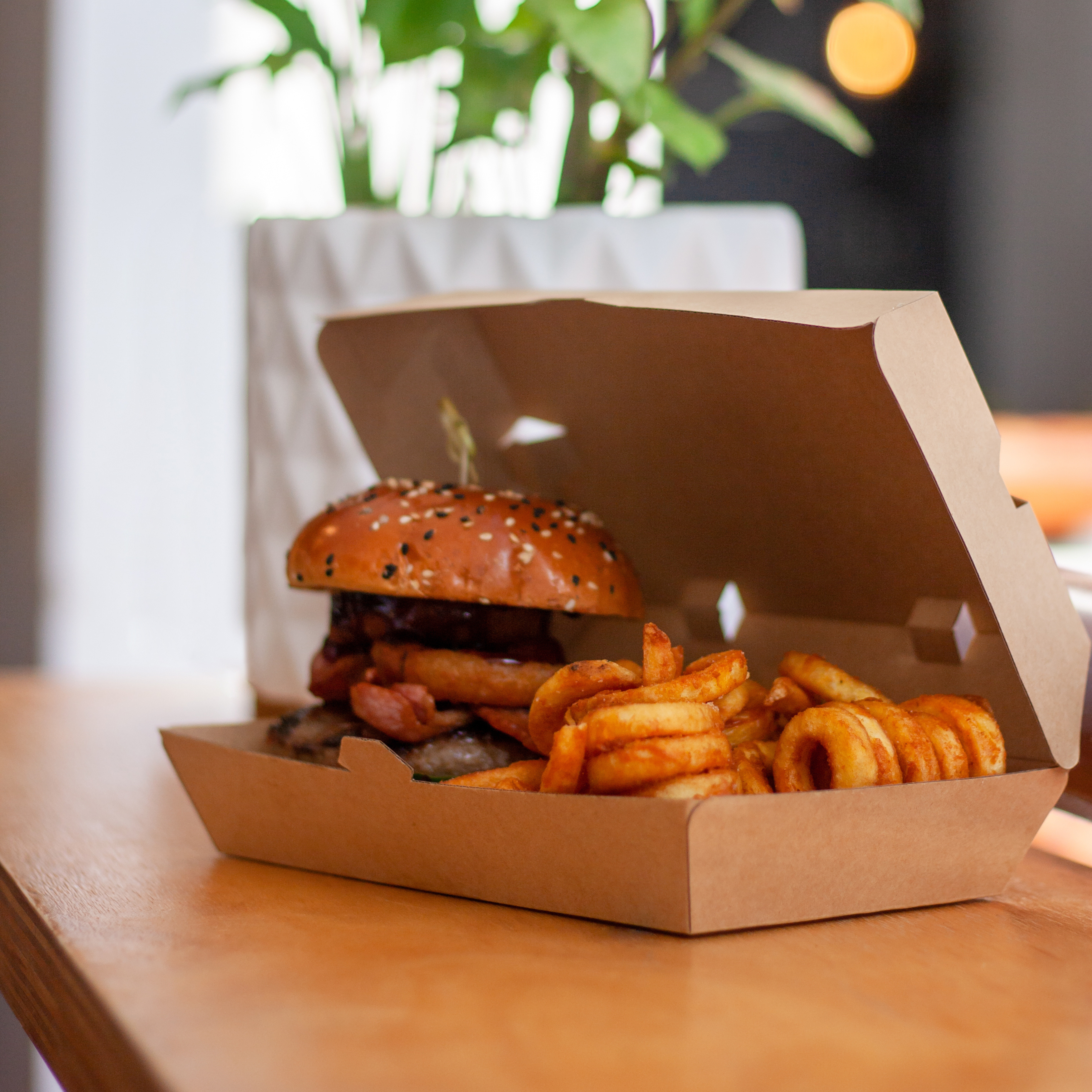Burger and curly fries in a Green Choice Large Snack box